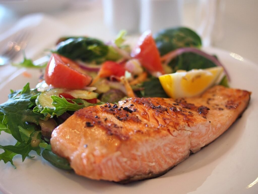 Grilled salmon with vegetables, a good dietary source of vitamin D